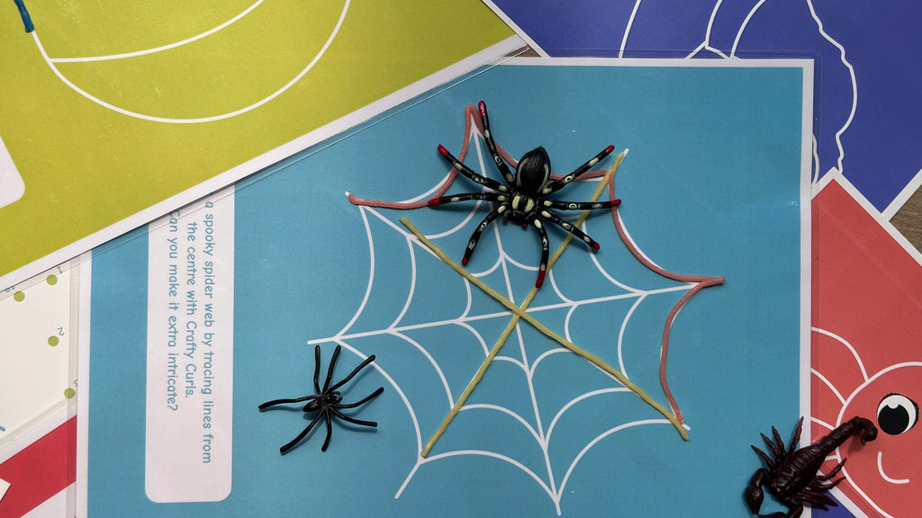 Halloween craft for kids: spider web made from reusable wax sticks for creative play Crafty Curls