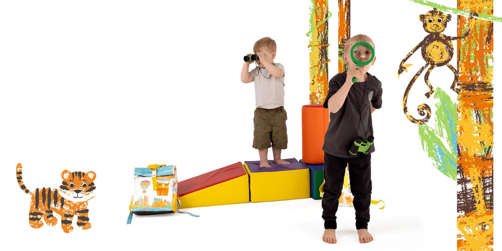 Two young kids playing jungle explorers with binoculars, next to an eco-friendly travel backpack and illustrated jungle animals