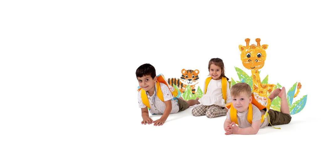 Three happy children wearing eco-friendly kids' travel backpacks, lying on the ground with illustrated jungle animals in the background