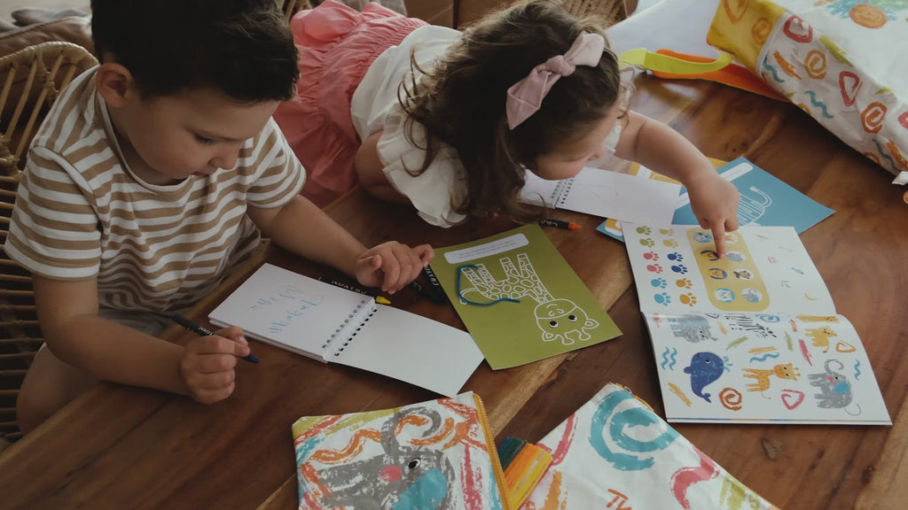 Kids exploring nature with Two Cubs eco-friendly travel essentials, including backpacks, wet bags, and crafty curls, designed for little adventurers